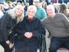 Peggy Dietrich, flanked by daughter-in-law Joyce (a paraprofessional within the district) and son Doug, smiles at the ceremony honoring her late husband.