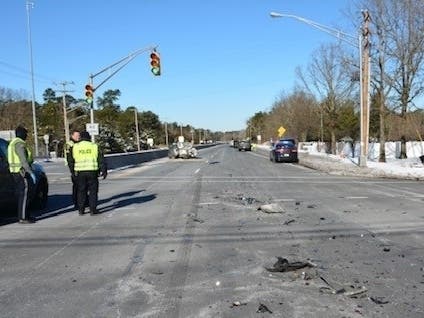 Two people were injured when a pickup truck rearended a car that was stopped at a red light on Route 37 at Colonial Drive in Manchester, police said.