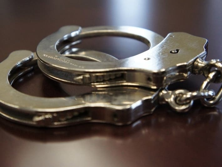 Five people were arrested and two handguns were seized Friday during a search at a Barnegat home, police said. 