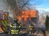 Firefighters battle a blaze at a home on the 100 block of Walnut Street in Brick on Monday. The home was destroyed. 