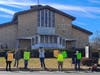 Protesters in front of Church of the Visitation in Brick on Sunday had one message: protect the 30-acre parcel in Breton Woods from becoming more homes. 