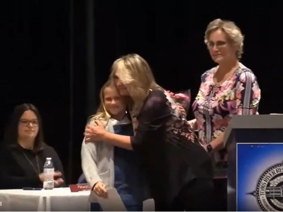 North Dover Principal Colleen McGrath hugs Lilly Bossow after presenting her with a leadership award at Wednesday's Toms River Regional Board of Education meeting. 
