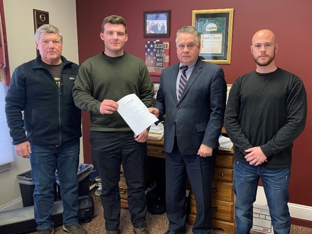 Point Pleasant Councilman Bill Borowsky Sr. and his son, U.S. Marine Bill Borowsky Jr., with Rep. Chris Smith and U.S. Marine Rocco Russo, with a copy of HR 7570, which would force the U.S. military to reinstate members discharged over the COVID vaccine.