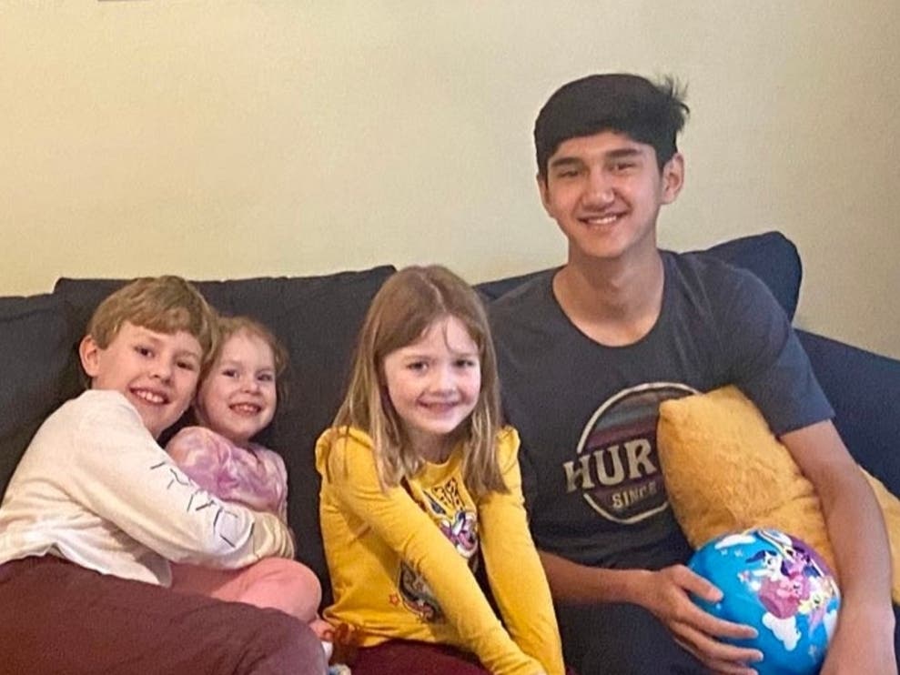 Mohammad Mir Shahnoory with the Williams children at their home in Brick. The family is sponsoring him while officials try to reunify him with his parents. 