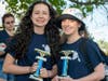 Callie Rommel of Manchester and Samantha Dawson of Little Egg Harbor receive their trophies after taking second place in a 10-mile endurance race at the General Clinton Canoe Regatta in Bainbridge, New York.