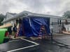 Work began Sunday to shore up and secure the building at Brilliant Environmental Services after the crash early that morning. 