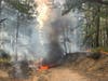 While EMTs were treating the two women, authorities went into the woods to extinguish the burning ATV, Manchester police said. 