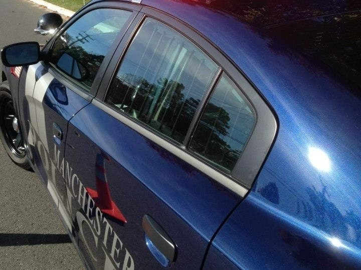 Manchester police are searching for a white car in an incident where the driver tried to entice a girl to get into his car after she got off the school bus on Friday, police said.