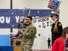 An active member of the armed forces is honored in a Manchester classroom.