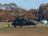 A military helicopter landed near the school for the Veterans Day Ceremony.