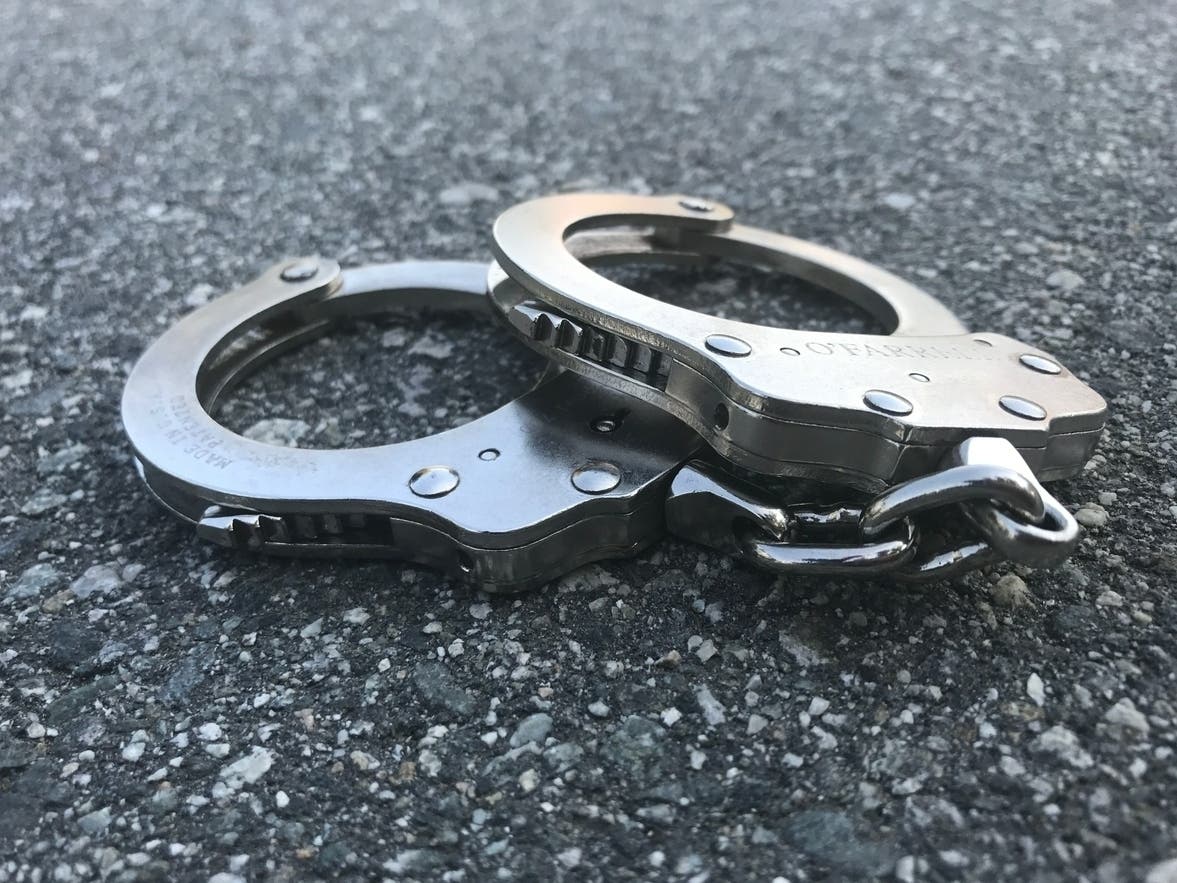 Manchester police said the man had an outstanding warrant and tried to run from police, but they chased him down. 