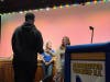A student honored at the pep rally receives his certificate from a member of the Manchester Township High School chapter of the National Honor Society.