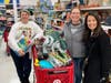 Kevin's Kids shoppers are all smiles carrying out the joyful task of filling wish lists for Kevin's Kids children. 
