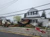 A small dump truck sits in the front part of a home at the corner of McLean Avenue and Route 35 north in Point Pleasant Beach after it crashed Wednesday.