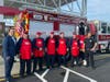 Wawa General Manager Anthony Rao (left) with the team for the Herbertsville Fire Company, which competed in the Hoagies for Heroes contest at the grand opening of the Lanes Mill store. 