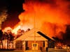 Flames and embers rise around a church off Beckerville Road in Manchester overnight Tuesday into Wednesday.
