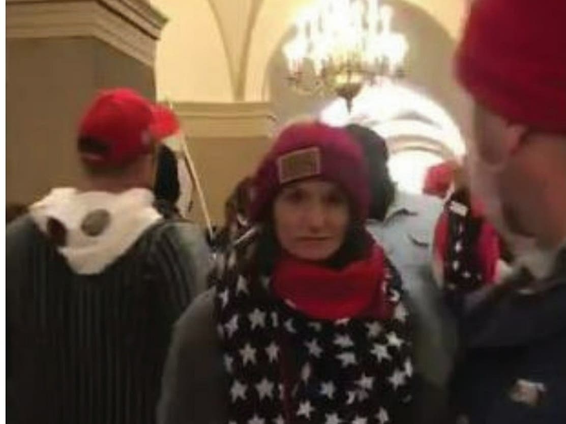 Anna Lichnowski, seen here in a photo from video surveillance inside the U.S. Capitol building, has been arrested in connection with the Jan. 6 insurrection. 