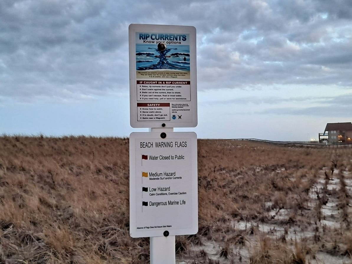 A sign in Ortley Beach gives a warning about rip currents. The dangerous surf and rip currents from Hurricane Lee has led Toms River Police Chief Mitchell Little to issue an executive order banning swimming for Sept. 15 until the red flag warning ends. 