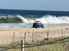 A worker patrols the beach in Point Pleasant Beach on Thursday on the watch for people trying to go in the ocean in spite of a swimming ban. Heavy surf, large waves and rip currents whipped up by Hurricane Lee offshore are expected all weekend. 
