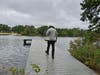 The father of a 13-year-old Brick Township boy walks out to the end of the dock at Lake Riviera Park, where he says his son was trapped and attacked on Sept. 14. A rally on Saturday aims to make meaningful change to stop bullying and protect victims. 