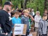 A boy holds a sign reading "Spread Kindness" at the anti-bullying rally, which drew more than 100 people. 