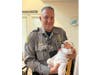 Police Officer Pete Saker helped Mia arrive safely into the world when she was born in her family's bathroom on Sept. 27.