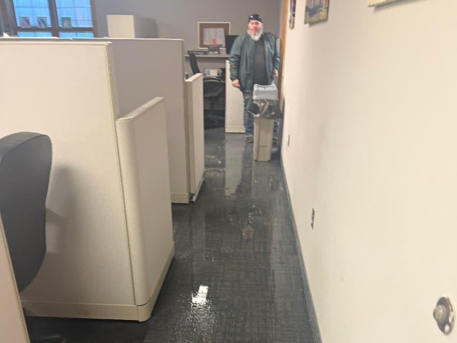 Water from pipes that burst and flooded Toms River Town Hall on Monday reflects the lights from the ceiling in an office at Town Hall. Flooding affected three floors of the building, Mayor Daniel Rodrick said.