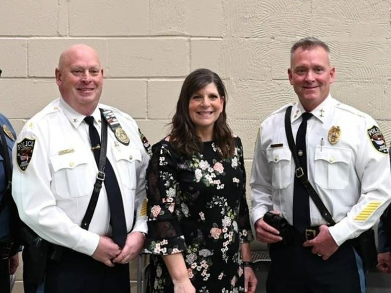 Then-Deputy Chief Henry Drew (left), Mayor Lisa Crate and Police Chief David Forrester after a police promotion ceremony in March 2025. Drew has been named acting police chief while Forrester finishes 2026 on administrative leave.