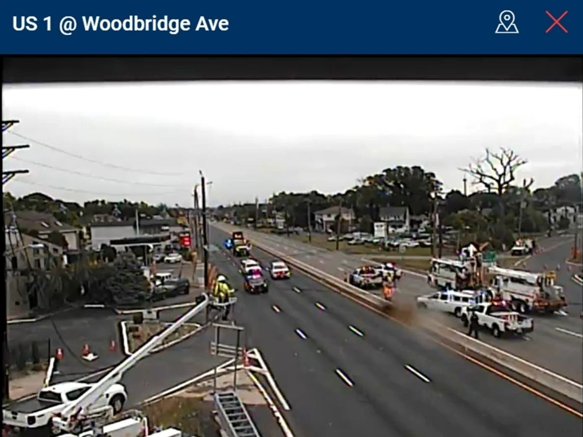 Crews work to reconnect wires along Route 1 near Woodbridge Avenue in Edison, which was closed in both directions Thursday morning. There were 120 homes and businesses still without power.
