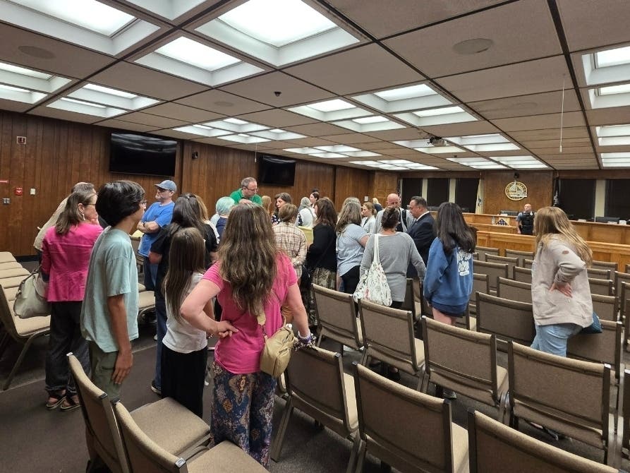 Residents speak with Brick Township Council members and Mayor Lisa Crate after Tuesday's council meeting where they expressed concerns about speeding and reckless drivers along Lanes Mill Road.