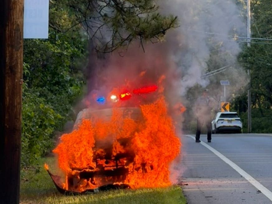 A 2006 black Toyota Camry is fully engulfed in flames on Route 539 in Manchester.