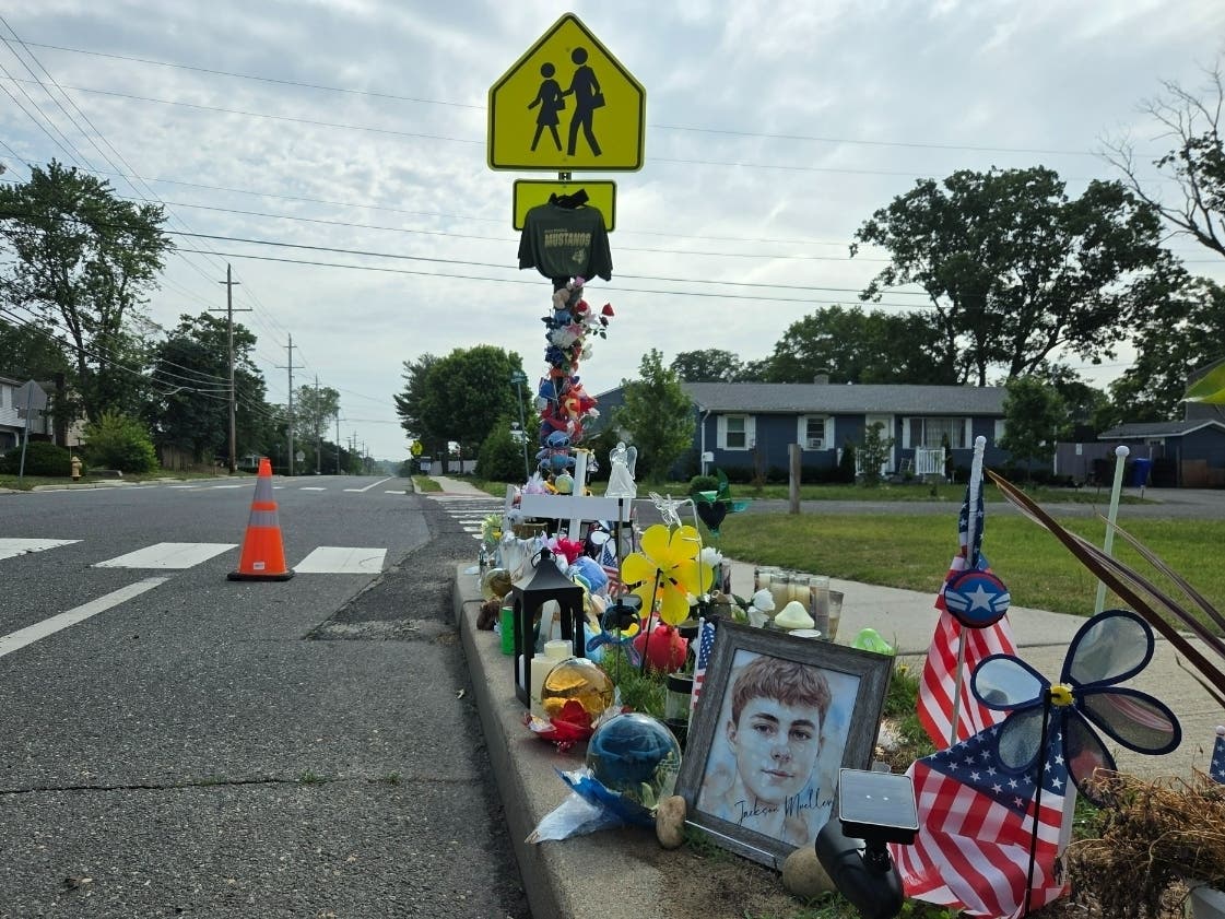 The memorial to Jackson Mueller has grown in the weeks since the 15-year-old was killed by a hit-and-run driver as he crossed Lanes Mill Road en route to school at Brick Memorial.