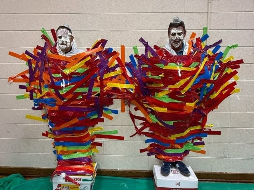 Drum Point Elementary School Principal Chris Ott and physical education teacher Donald MacCarrick were pied in the face and left stuck to the wall with dozens of pieces of duct tape. 