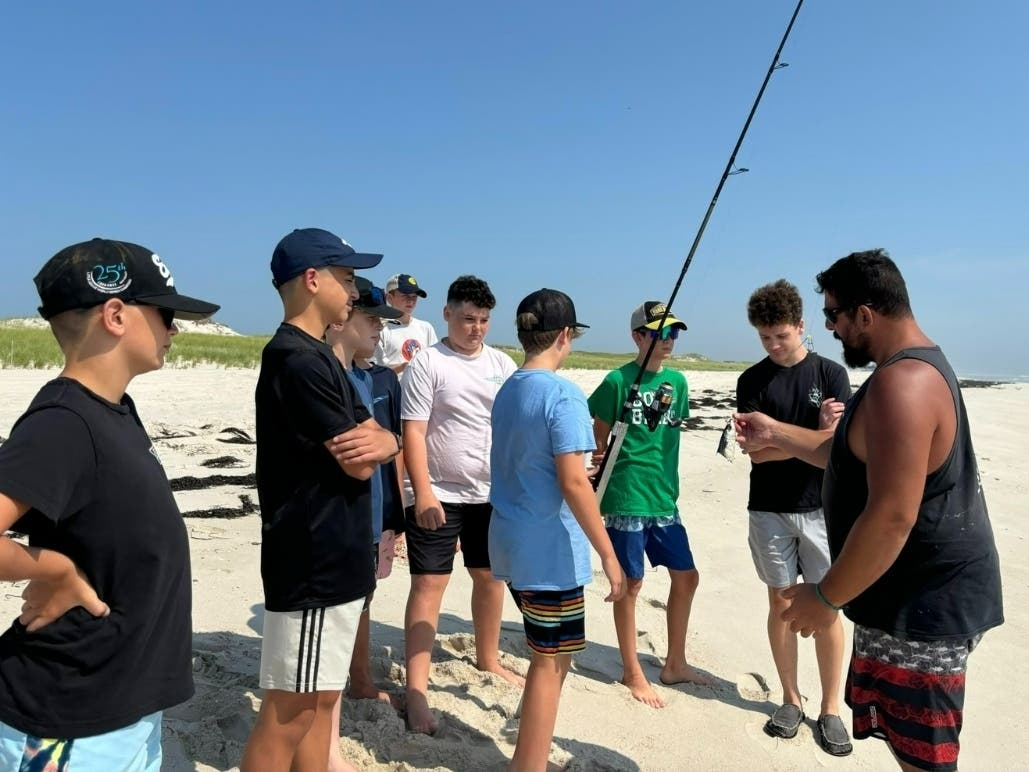 Sean Smida (right) instructs kids during the Kids Fishing Clinic through the Ocean County Parks and Recreation department in 2024.
