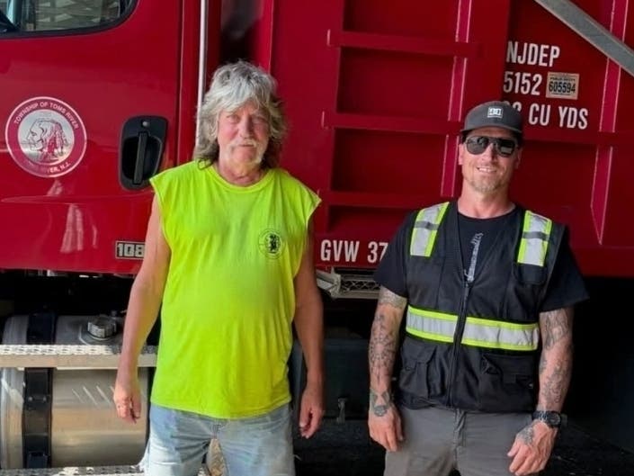 Louis Reed and Ed Kempker from Toms River's public works department were praised by officials for helping the young boy who was in distress.