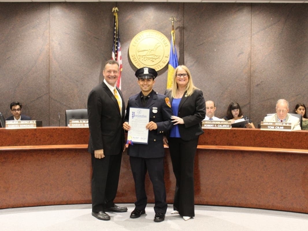 Left to Right: Legislator Samuel Gonzalez, Police Officer Kevin Bell and Legislator Susan A. Berland