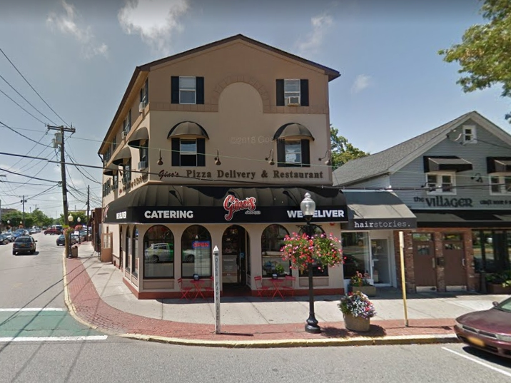 Keith Dahmen, who opened the popular Gina's Pizza of Babylon in 1983, announced his retirement on Wednesday.