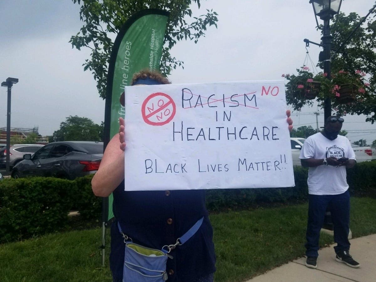 Protesters gathered in front of Southside Hospital on Saturday after one nursing student was fired for sending racist messages on social media.