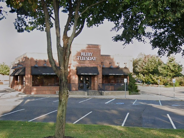 The man was discovered behind the Ruby Tuesday on 403 Commack Rd. at about 8 p.m. Monday.