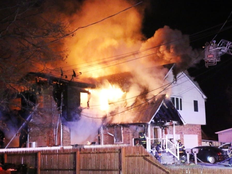The blaze broke out at the Carleton Ave. home at about 12:34 a.m.
