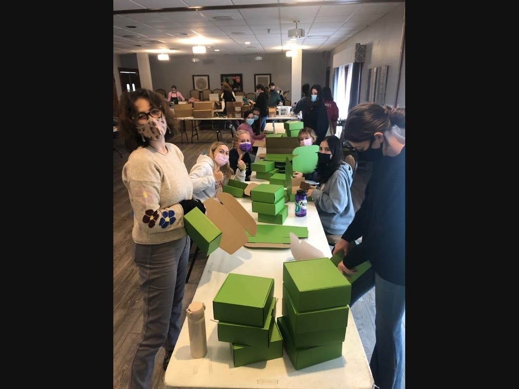 Members of Woodlands Academy’s junior class spent their Nov. 1 Service Day in Libertyville,  where they prepared more than 2,000 packages to be sold at Lambs Farm’s non-profit store during the Christmas season.   