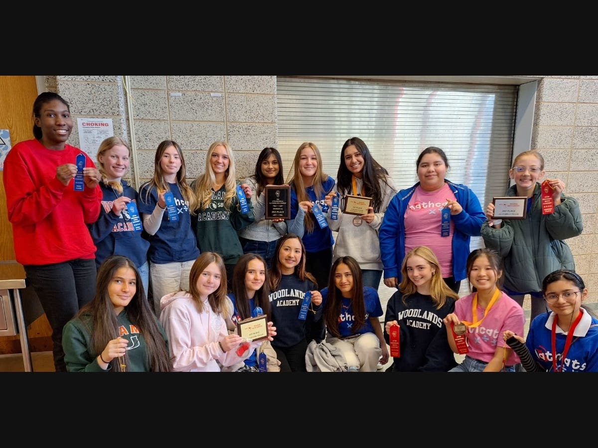 Members of the state finals bound Woodlands Academy MathCats team display team and individual honors received in Division 1A competition at the 2024 ICTM Region 20 Competition held at Niles West High School in Skokie.  