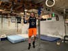  Jake Scionti practicing in his home basement, which has turned into a full-fledged training ground.