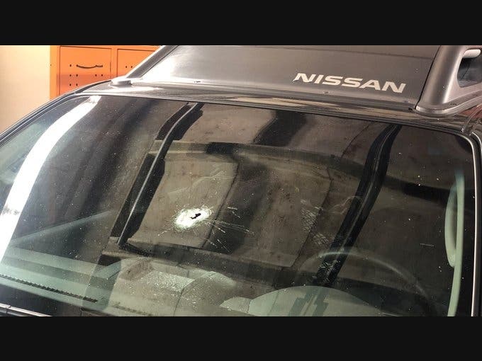 A car was hit by a bullet at Bowlero in Milford Tuesday night.