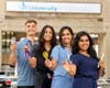 Rutgers New Jersey Medical students — aka the Bergen Barbers — Ivan Loncar, Hetal Lad, Sowntharya Ayyappan and Shivani Srivastava outside University Hospital in Newark. 