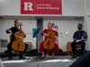 As Frankie Carr, left, Arlen Hlusko play the cello, Arts in Health Scientist in Residence AZA Allsop listens during the Arts in Health celebration and well-being concert at Ackerson Hall at Rutgers School of Nursing in Newark.