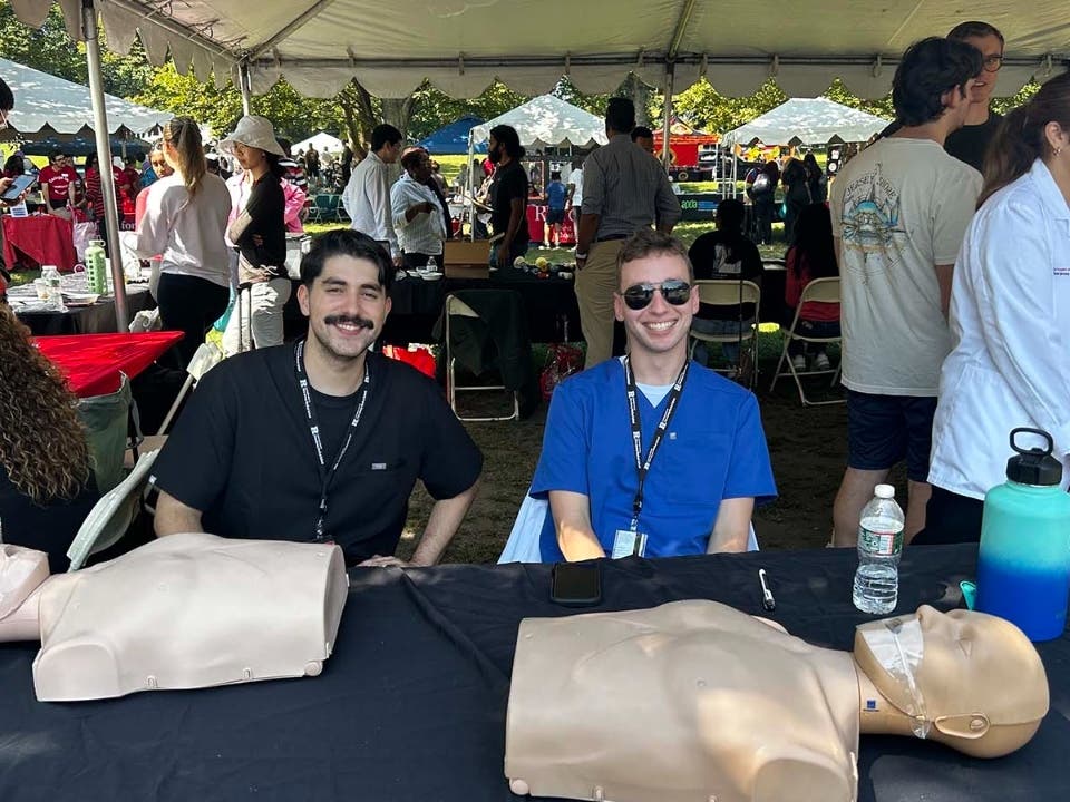 Medical students Justin Roskam and Chris Mansur, Class of 2029, presenting Bystander CPR to participants at the Annual CareSparc Community Connections’ Annual Sustainable Health & Wellness Village Fest.
