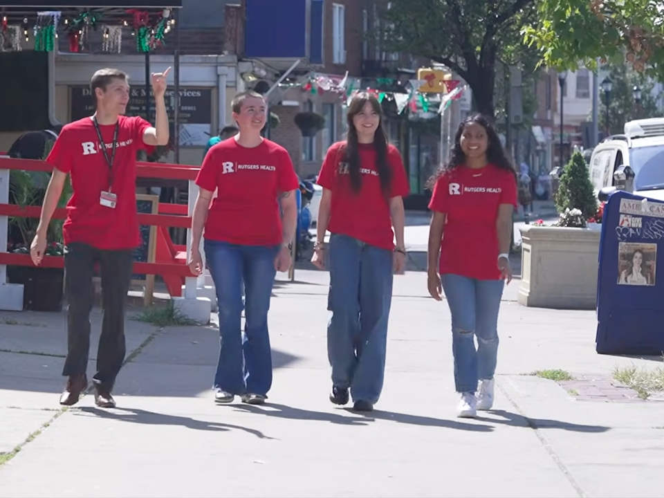 From left: Jack Hemphill, program manager, Rutgers Health Service Corps, in New Brunswick with volunteers Megan Ulozas (Engineering, alumna), Jackelinne Firme (School of Arts and Sciences, alumna) and Saanvi Narava (School of Arts and Sciences).