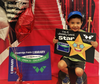 Red Carpet Kid! Young boy celebrates getting a Woodridge Library card.