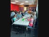 Families attending a February art class at the Woodridge Public Library, designing pieces for a shared art assemblage.